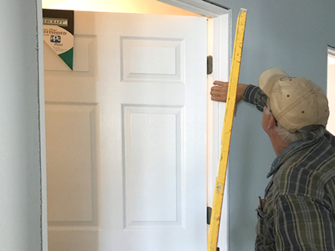 Volunteers work with homeowners to build and repair Door Habitat Home.